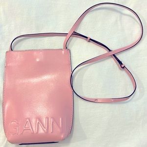Ganni smooth leather crossbody in pink.